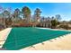 A community pool is shown with the pool covered for the off-season in this outdoor image at 6746 Lake Erie Ln, Fairburn, GA 30213