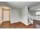 Open entryway with stairs leading to the upper level and hardwood flooring at 6746 Lake Erie Ln, Fairburn, GA 30213