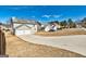 Traditional two-story home with a two-car garage and a long driveway in a suburban neighborhood at 6746 Lake Erie Ln, Fairburn, GA 30213