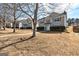 Attractive exterior view of the house in a suburban neighborhood with well-maintained lawns at 6746 Lake Erie Ln, Fairburn, GA 30213