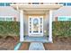 Welcoming front entrance with a glass-paneled door and neatly trimmed hedges at 6746 Lake Erie Ln, Fairburn, GA 30213