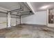 Spacious garage with a large garage door and plenty of room for parking and storage at 6746 Lake Erie Ln, Fairburn, GA 30213