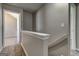 Upstairs hallway featuring carpeted floors and neutral paint at 6746 Lake Erie Ln, Fairburn, GA 30213