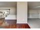 Spacious living area with hardwood flooring transitioning to carpeted area and staircase access at 6746 Lake Erie Ln, Fairburn, GA 30213