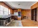 Cozy kitchen featuring wood cabinetry, stainless steel sink, and vintage charm at 2864 S 100 Hwy, Bowdon, GA 30108