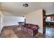 Living room with pool table, sofa, and seamless access to the kitchen at 2864 S 100 Hwy, Bowdon, GA 30108