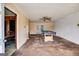 Living room with a billiards table, adjacent to a room and doorway for seamless access at 2864 S 100 Hwy, Bowdon, GA 30108