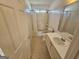 Traditional bathroom with a shower-tub combo, toilet, vanity, and tile flooring at 419 Kara Ln, Mcdonough, GA 30253