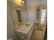 Bathroom with a vanity and a large mirror reflecting the view into an adjacent room at 419 Kara Ln, Mcdonough, GA 30253