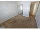 A cozy bedroom with carpet flooring and a sliding door closet for optimal storage space at 419 Kara Ln, Mcdonough, GA 30253