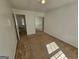 Comfortable bedroom with neutral carpet, mirrored closet doors, and a bright window at 419 Kara Ln, Mcdonough, GA 30253