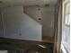 A bright foyer with a carpeted living space visible beyond, complemented by a window at 419 Kara Ln, Mcdonough, GA 30253