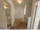 Hallway with neutral carpet that connects the bathroom and bedrooms upstairs at 419 Kara Ln, Mcdonough, GA 30253