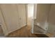 Upstairs hallway between bedrooms and bathroom with carpet at 419 Kara Ln, Mcdonough, GA 30253