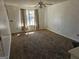 Living room with neutral carpet, natural light, and a ceiling fan at 419 Kara Ln, Mcdonough, GA 30253