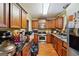 Kitchen with wooden cabinets and stainless steel appliances at 6226 Lullwater Dr, Douglasville, GA 30135