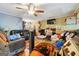 Living room with ceiling fan, hardwood floors, and furniture at 6226 Lullwater Dr, Douglasville, GA 30135