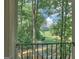 Scenic view of the golf course from the home's elevated porch at 101 Glen Eagle Way, Mcdonough, GA 30253