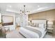 A spacious main bedroom featuring neutral decor, large windows, and an ensuite bathroom entrance at 5711 Tillman Way, Powder Springs, GA 30127