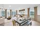 The open-concept layout seamlessly integrates the living, dining and kitchen areas with lots of natural light at 5711 Tillman Way, Powder Springs, GA 30127
