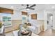 A well lit living area with cozy seating and large windows providing lots of natural light at 5711 Tillman Way, Powder Springs, GA 30127