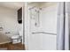 Well-lit bathroom with tiled shower featuring safety bar and updated fixtures at 3600 Old Stilesboro Nw Rd, Kennesaw, GA 30152