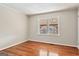 Bright bedroom featuring hardwood floors and natural light from window at 3600 Old Stilesboro Nw Rd, Kennesaw, GA 30152