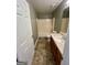 Cozy bathroom with a shower/tub combo, single sink vanity, and tile flooring at 2395 Peeksville Rd, Locust Grove, GA 30248