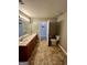 Bathroom featuring a double sink vanity, tiled flooring, and toilet at 2395 Peeksville Rd, Locust Grove, GA 30248