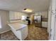 Modern kitchen featuring stainless steel appliances, white cabinetry, and a peninsula counter, perfect for casual dining at 2395 Peeksville Rd, Locust Grove, GA 30248