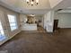 Bright kitchen featuring white cabinets, laminate countertops, stainless steel appliances, and tile flooring at 2395 Peeksville Rd, Locust Grove, GA 30248