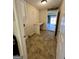 Functional laundry room featuring storage cabinets, a countertop, and convenient access to the garage at 2395 Peeksville Rd, Locust Grove, GA 30248