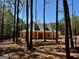 Charming yellow two-story home with dormers nestled among the trees at 3 Bob Smith Rd, Sharpsburg, GA 30277