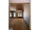 Unfinished interior with arched ceiling, entry way, and wood flooring at 3 Bob Smith Rd, Sharpsburg, GA 30277