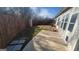 Backyard view showing patio, grass, and a wooden fence at 505 City Park Dr, Mcdonough, GA 30252