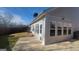 Backyard view showing patio, grass, and the exterior of the sunroom addition at 505 City Park Dr, Mcdonough, GA 30252