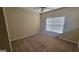 Bedroom with neutral carpet, ceiling fan, and a window letting in natural light at 505 City Park Dr, Mcdonough, GA 30252