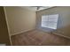 Bedroom with neutral walls, wall-to-wall carpeting and a large window at 505 City Park Dr, Mcdonough, GA 30252