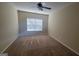 Carpeted bedroom featuring a ceiling fan and large window with blinds at 505 City Park Dr, Mcdonough, GA 30252
