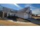 Traditional-style home with gray siding, brick accents, and a well-manicured lawn at 505 City Park Dr, Mcdonough, GA 30252