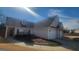 Traditional-style home with gray siding, brick accents, and a well-manicured lawn at 505 City Park Dr, Mcdonough, GA 30252