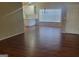 Open-concept living room featuring hardwood flooring, and kitchen island at 505 City Park Dr, Mcdonough, GA 30252