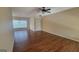 The living room features new hardwood floors, a ceiling fan and ample natural light from the large window at 505 City Park Dr, Mcdonough, GA 30252