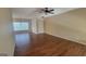 Spacious living room featuring wood flooring, a window, and a chandelier at 505 City Park Dr, Mcdonough, GA 30252