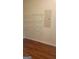 Storage space featuring hardwood flooring, shelving, and electrical panel at 505 City Park Dr, Mcdonough, GA 30252
