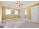 Bedroom featuring a ceiling fan and natural light through the large window at 732 Cascade Sw Ave, Atlanta, GA 30310