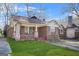 Charming brick home with a well-maintained lawn and traditional architectural details at 732 Cascade Sw Ave, Atlanta, GA 30310