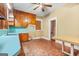 Retro kitchen featuring wooden cabinets and light blue countertops and a window for natural light at 732 Cascade Sw Ave, Atlanta, GA 30310