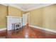 Living room with fireplace, hardwood floors, and neutral paint at 732 Cascade Sw Ave, Atlanta, GA 30310