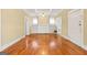Bright living room with hardwood floors, a fireplace, and built-in shelving at 732 Cascade Sw Ave, Atlanta, GA 30310